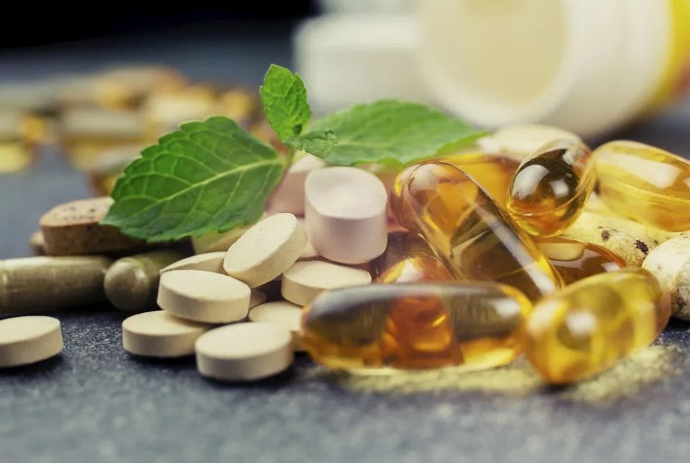 Omega Daily — capsules and tablets with fresh mint leaves